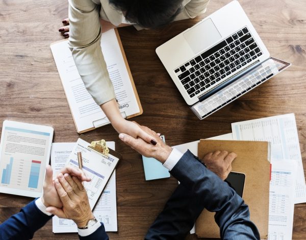 business-people-shaking-hands-together (1)